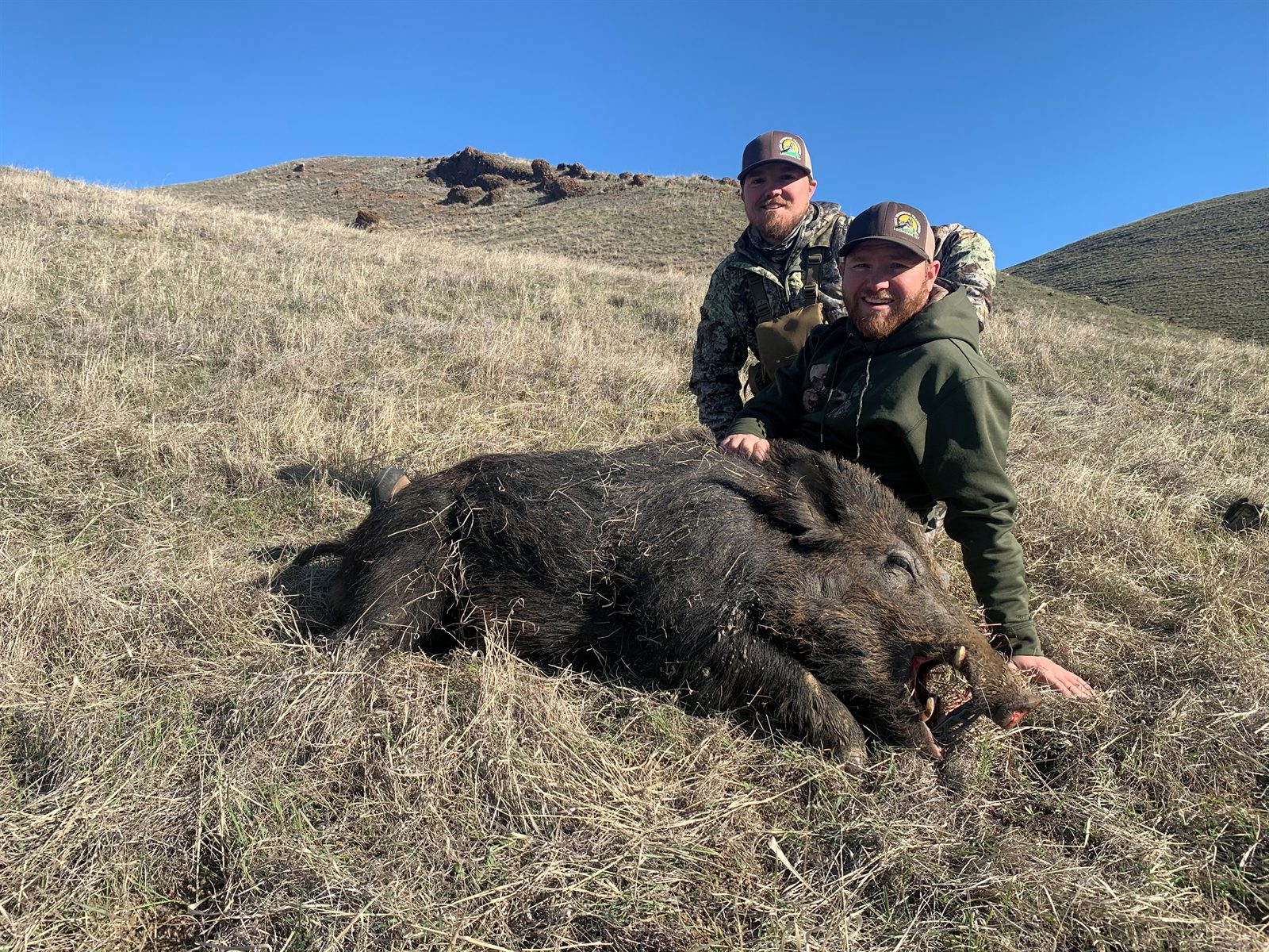 Payton and his brother with a wild game harvest